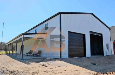 New metal building with large garage doors and covered porch.