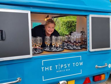 Woman serving drink from a mobile bar