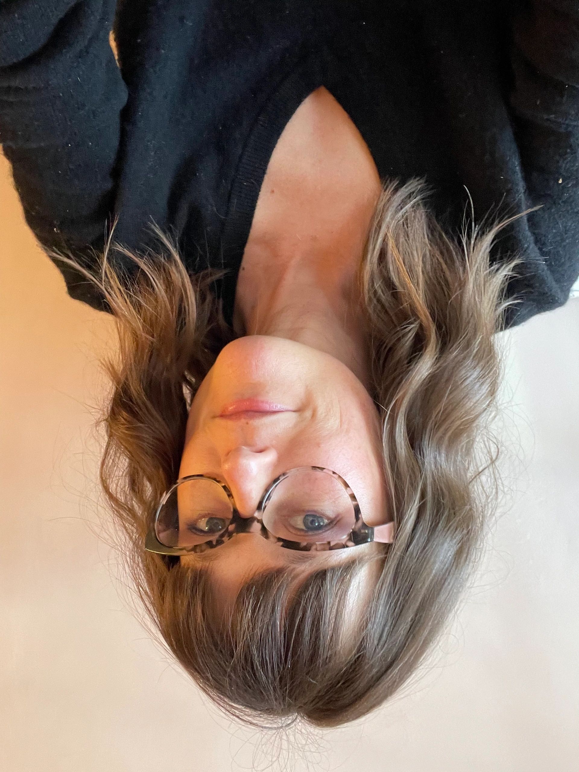 Caroline Frost author of POSSUM RUN. Woman early 40s wearing glasses. Cute haircut. Looks like she w