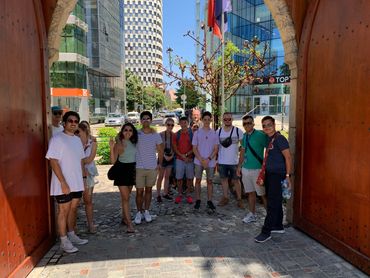 Participants walking along Murat Toptani Pedestrian Street, experiencing local culture on the Tirana