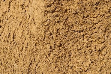 Close-up of fine, light brown sand texture.
