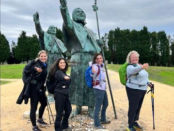 Traycee and other ladies near a statue