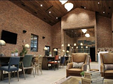 Indoor event space with high ceiling and coffee station