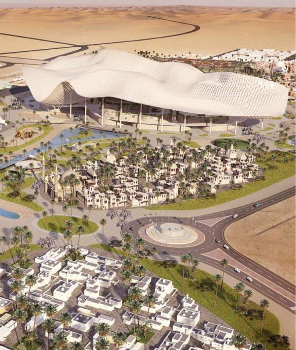 Futuristic desert city with wave-like roof and clustered buildings.