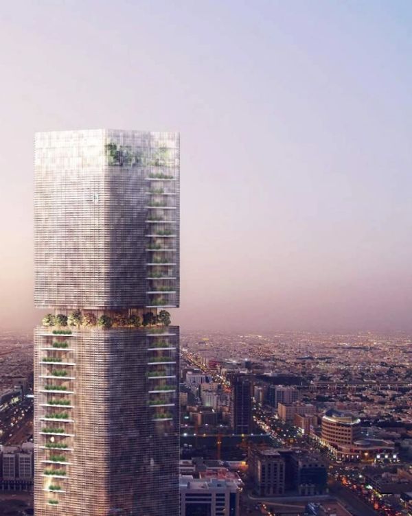 Modern architecturally unique skyscraper at sunset.