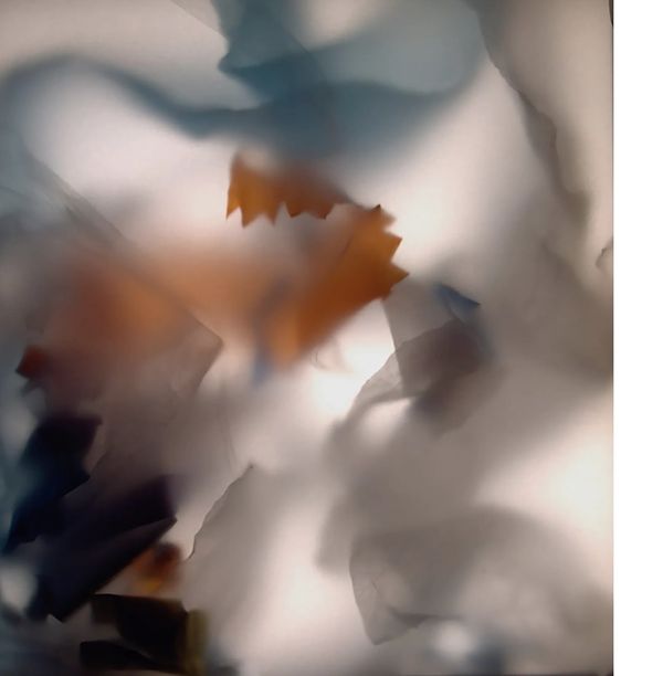 a clouded image , orange, pale blue, grey and white swirl randomly