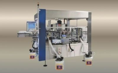 Automated labeling machine with paint buckets.