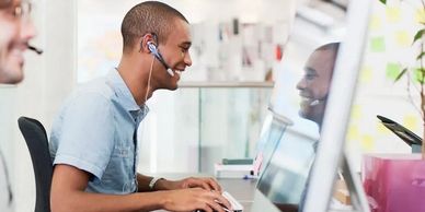 Truck dispatcher booking loads on computer