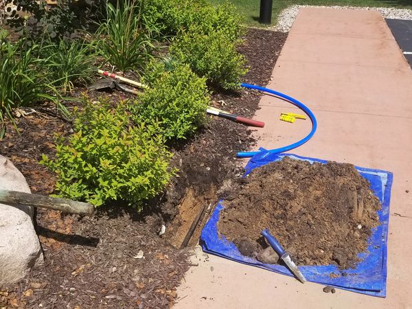 Irrigation system repair being made