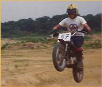 Close up shot of a man showing stunt with a bike