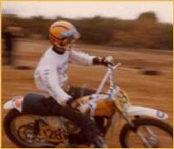 Close up shot of a bike running at a high speed inside a field