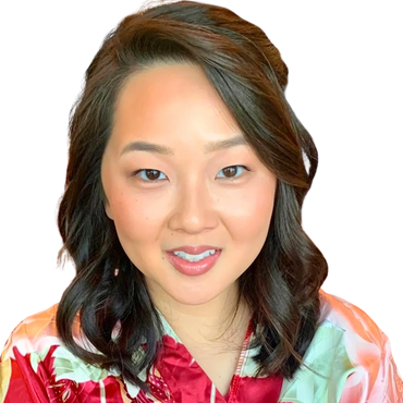 A gorgeous Asian woman wearing radiant glowy airbrush makeup with nude eyeshadow tones and pink lips