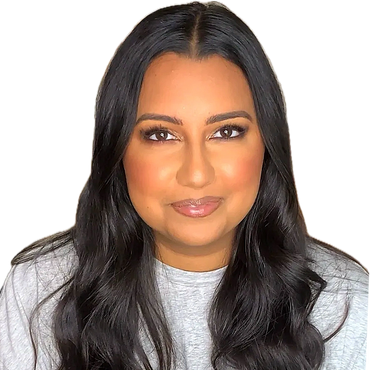 A gorgeous Indian woman wearing smoky eyes and a nude lip with radiant glowing skin for her birthday