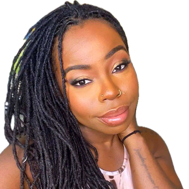 A beautiful black woman with natural locs wearing sultry eyes and soft glam makeup and lashes.