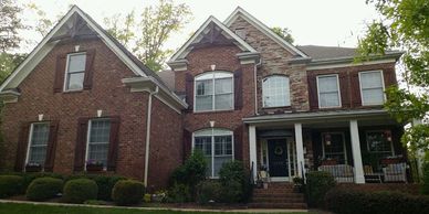 Cedar board and batten shutters and cedar gables