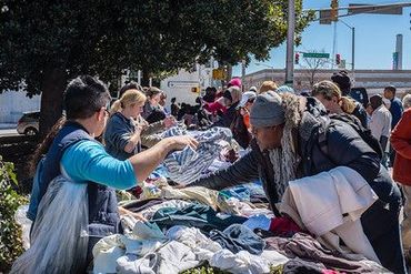 Donating clothing to our homeless community.