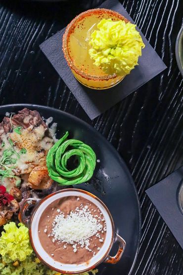 Custom cocktail and tampiquena; our in house filleted carne asada topped with cheese and shrimp