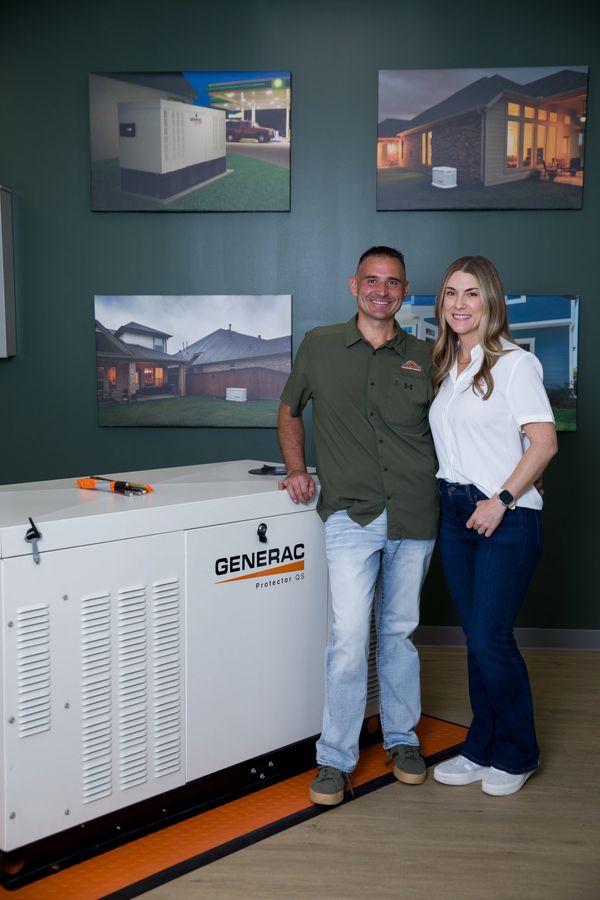 Houston Equipment Repair owners standing in generator showroom in Tomball Texas