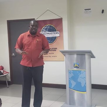 A captivating JJ delivers to the members of the JN Articulators Toastmasters Club in Montego Bay.