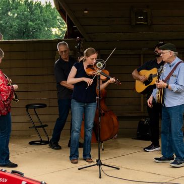 A group playing instruments on stage.