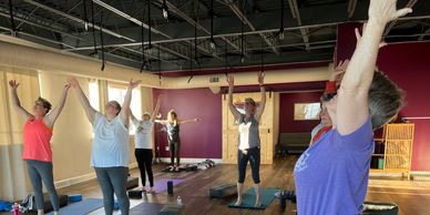 Students practicing in a Yoga Basics class.