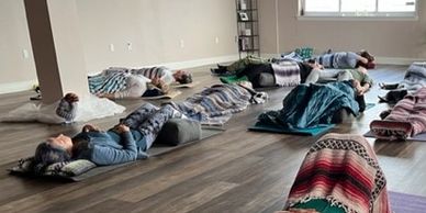Students practicing Yoga Nidra.