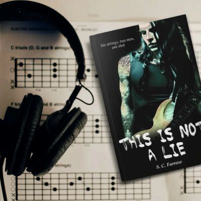 A copy of the novel titled This is Not a Lie on top of sheet music written for guitar.