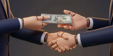 Two business people exchanging money while shaking hands in a deal.