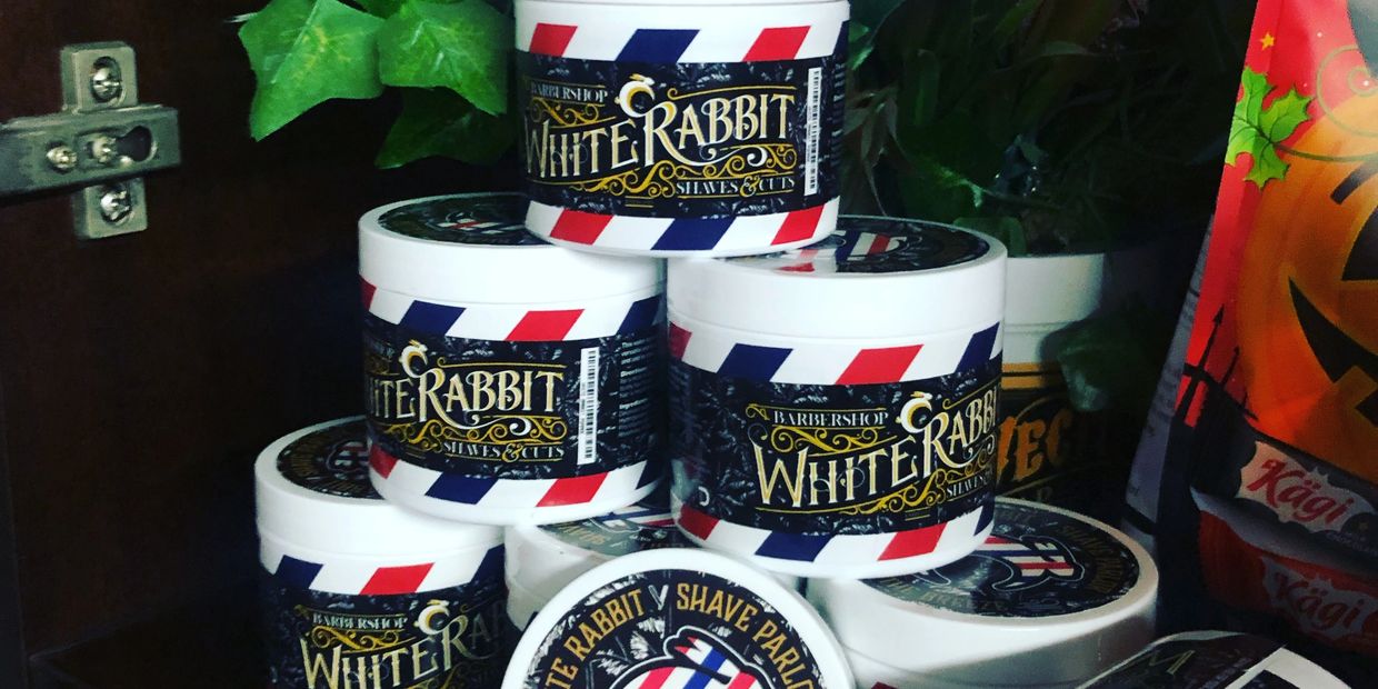 Stack of white rabbit pomade