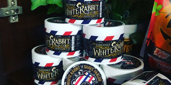 Stack of white rabbit pomade