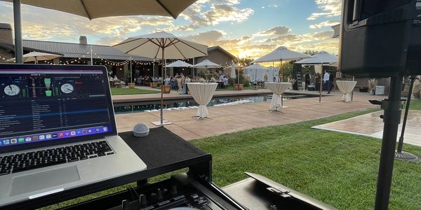 DJ set up at a wedding poolside. Wedding event DJ set up. Sound system for outdoor event.