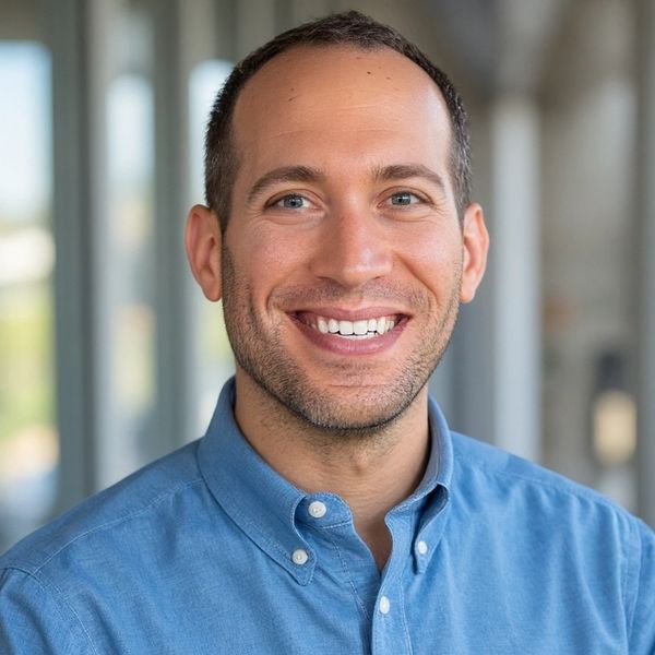 Photo of Dr. Hirsh in a blue button down shirt.