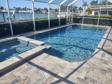 Pebble Tec finish and travertine deck