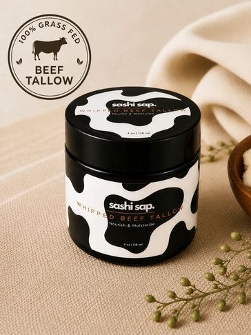 Jar of Sashi Sap whipped beef tallow moisturizer with cow print design.