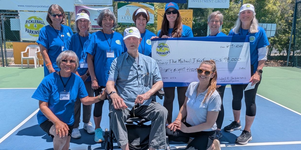Group photo with a large check for Pickleball 4 Parkinson's event.