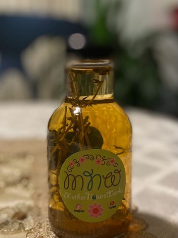 kombucha vinegar infused with herbs and ginger to be used to create your own salad dressing