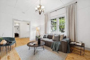 Bright living room with modern furniture and natural light.