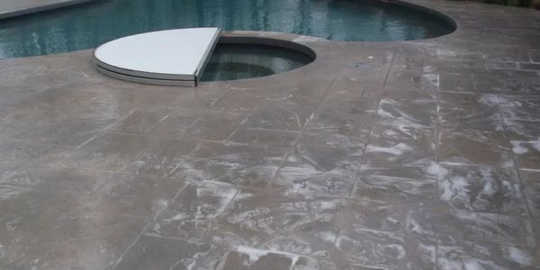 Professional Cleaning of a stamped concrete pool deck