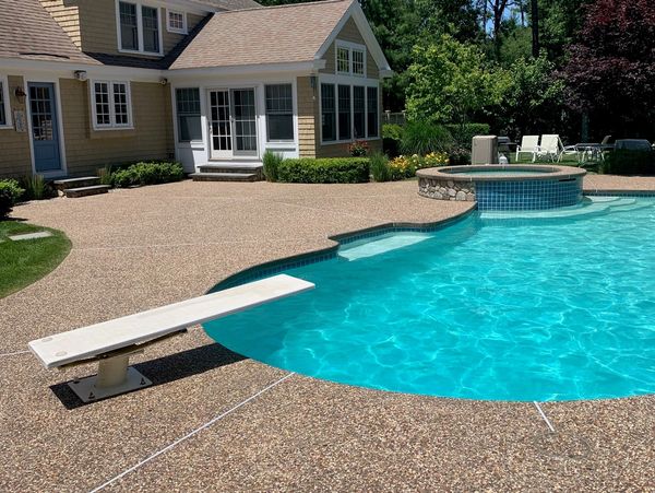 Exposed Aggregate  Concrete Pool Deck after cleaning and Sealing Application