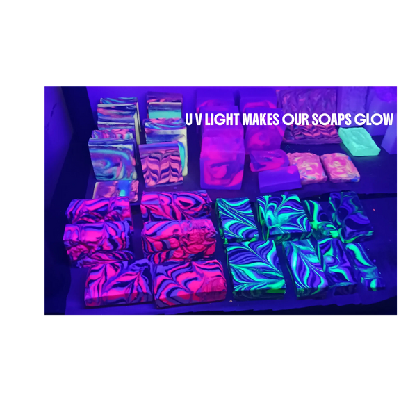 Colorful soaps glowing under UV light in vibrant patterns.
