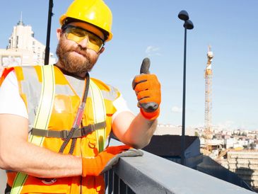 Construction worker giving a thumbs because the team has a good construction bookkeeper