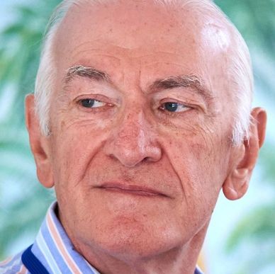 Dave Sivers looks off-camera in a close-up portrait photo