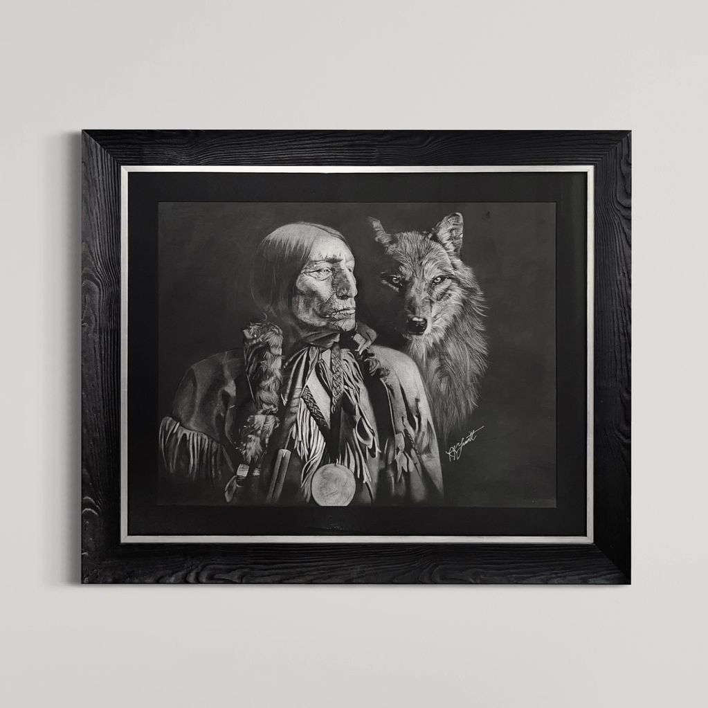 Black and white portrait of a Native American and a wolf.