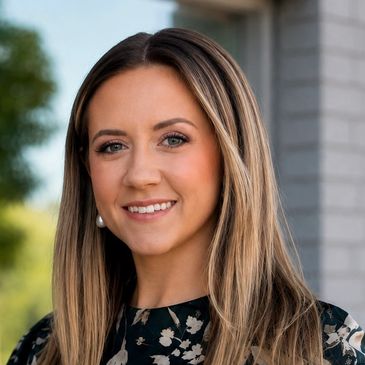 Smiling woman with straight long hair outdoors.