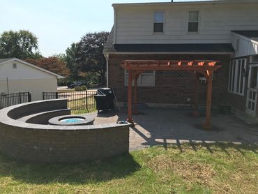 Paver patio with custom bench, gas firepit and cedar pergola