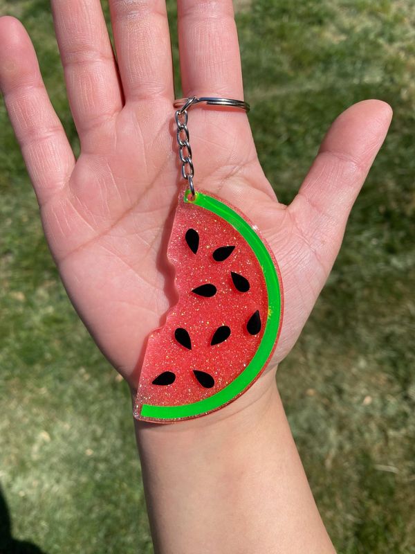 This cute watermelon is a 3 inch acrylic  key chain sealed with resin for durability.