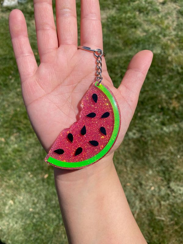 This cute watermelon is a 3 inch acrylic  key chain sealed with resin for durability.