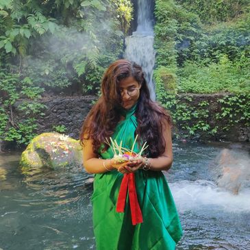 Sahej partaking in a water cleansing ritual in Bali