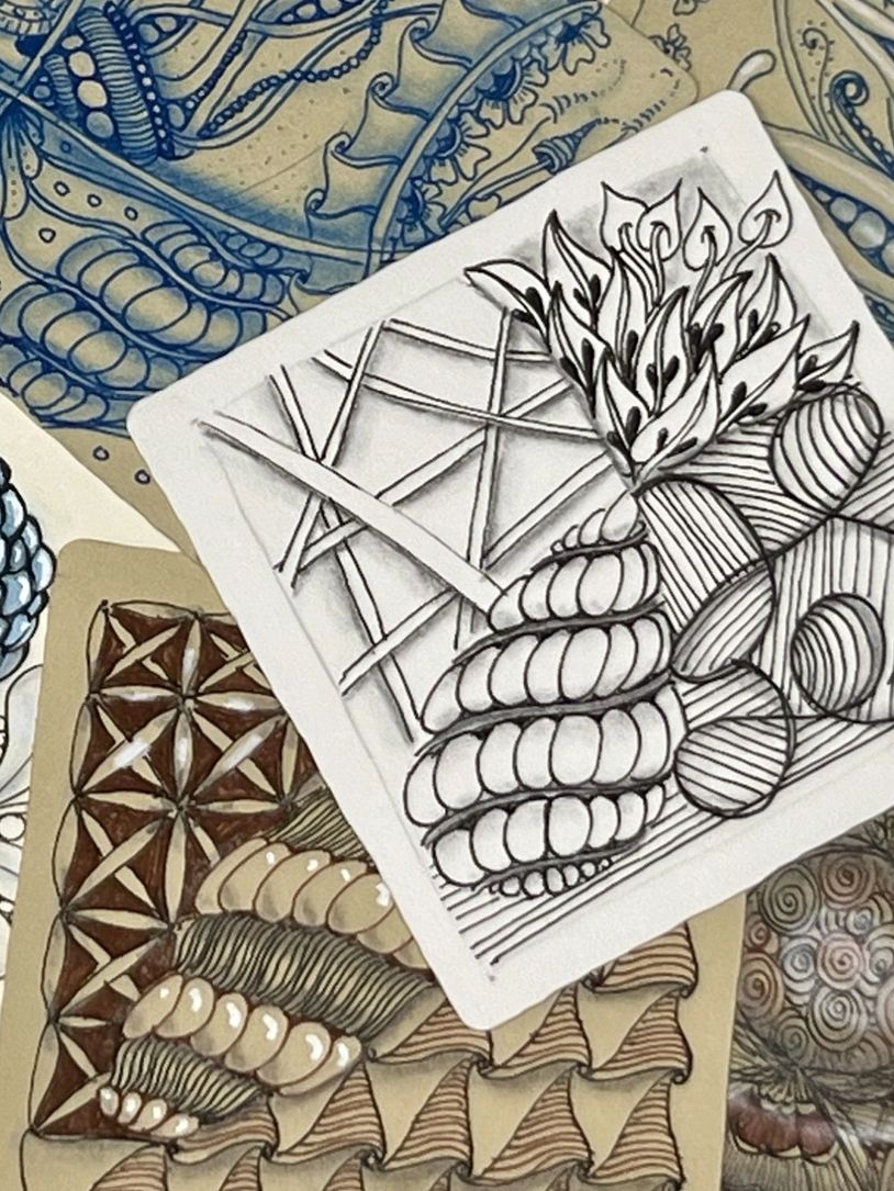 Intricate abstract doodle art with organic and geometric patterns in black, white, and brown tones.