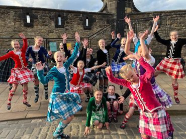 Scottish Highland dancing group celebrating.